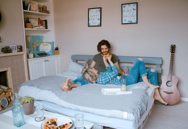 Couple Having Breakfast in Bed