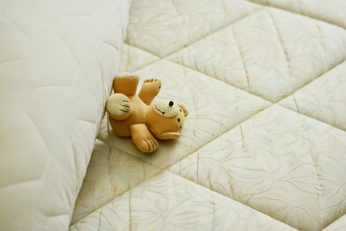 teddy bear on firm mattress